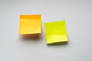 yellow sticky notes on white wall